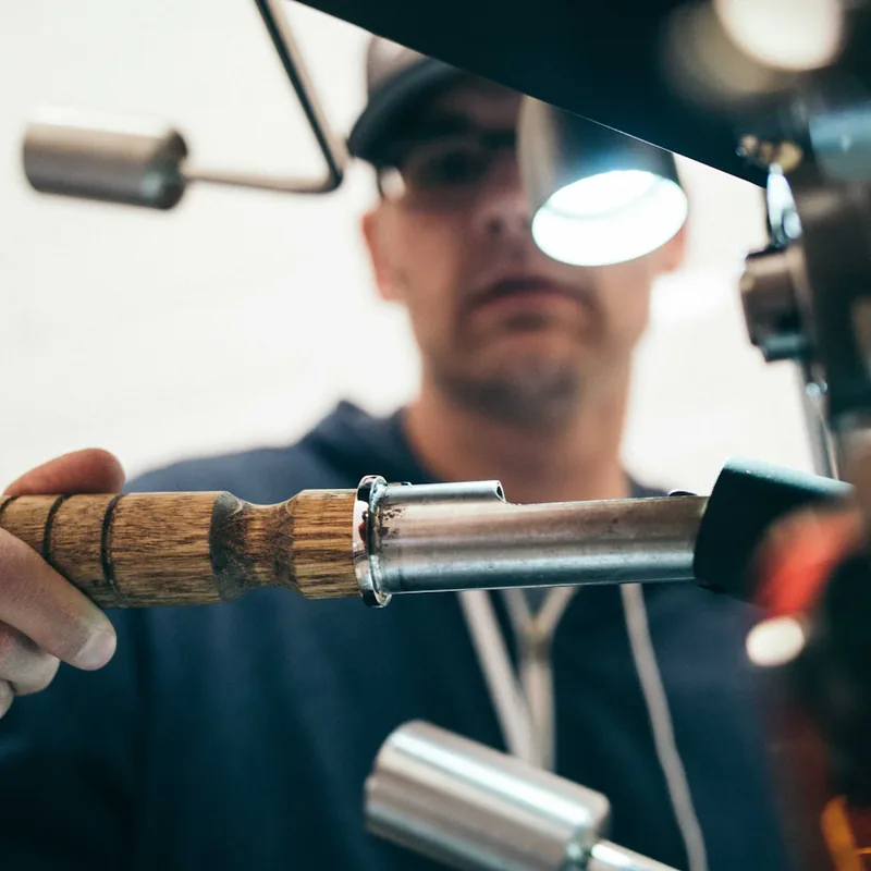 Kama'aina Locksmith craftsman precision-cutting a key in Honolulu